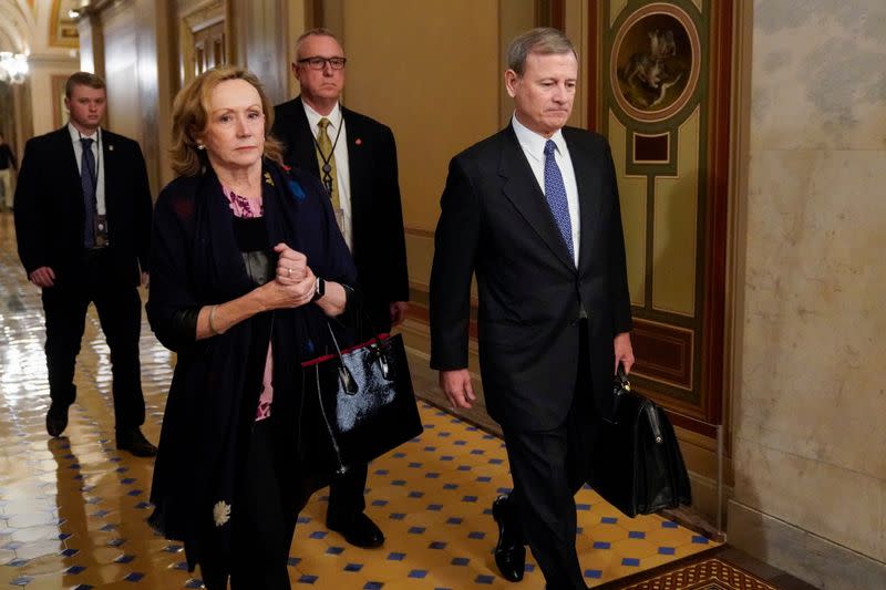 Chief Justice Roberts departs after the Trump impeachment trial ended for the day in Washington.