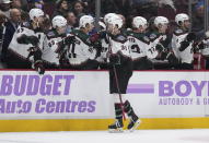 Arizona Coyotes' Christian Fischer (36) celebrates his goal against the Vancouver Canucks during the first period of an NHL hockey game in Vancouver, British Columbia on Saturday, Dec. 3, 2022. (Darryl Dyck/The Canadian Press via AP)