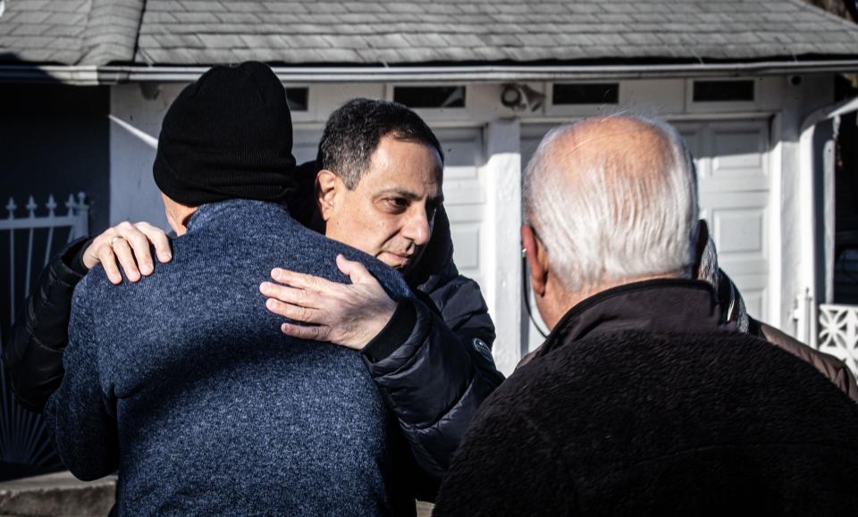 Father Soterios Baroody, pastor of St. George Orthodox Church in Yonkers, hugs a church member outside the church on Buckingham Road Dec. 12, 2023. An overnight fire destroyed a building that sits behind the church. The building, formerly used as a school when the church property was owned by a previous church, was mostly unused at the time of the fire. No injuries were reported.