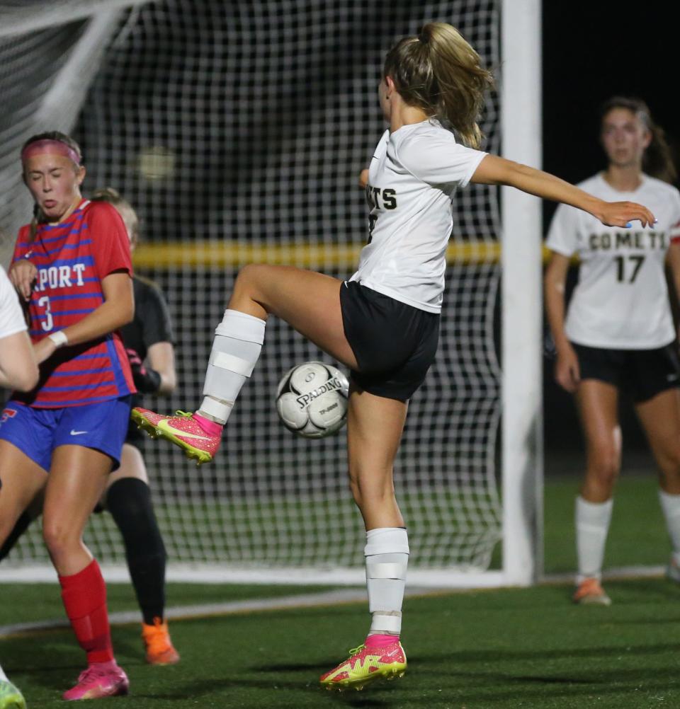 Rush-Henrietta's Catrina Rowe gets a foot on a cross near the Fairport goal but sends it just wide.