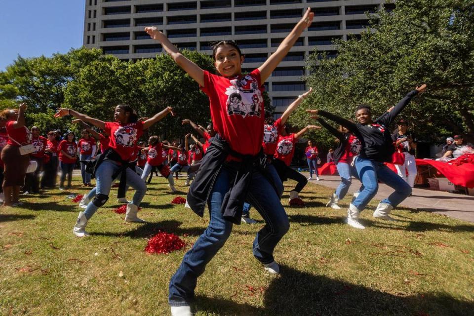 Members of the Girls Inc. of Tarrant County perform a dance routine before the 2023 Day of the Girl march event at Burnett Park in Fort Worth on Friday.