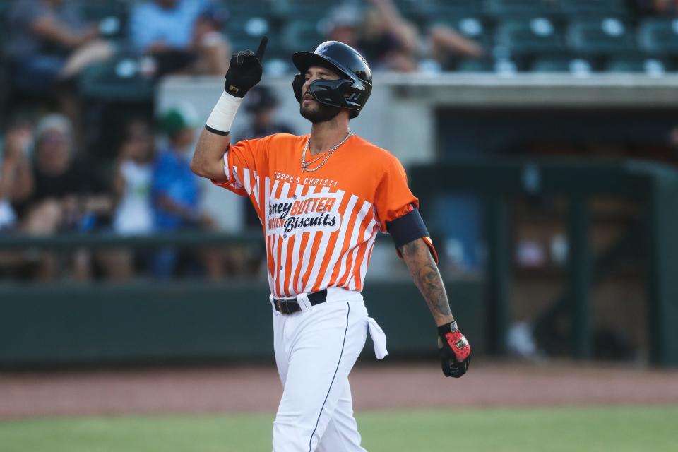 Hooks infielder Joe Perez (4) raises a finger after hitting a home run in a game against Northwest Arkansas at Whataburger Field in Corpus Christi, Texas on Wednesday, July 13, 2022. The Hooks won 10-3.