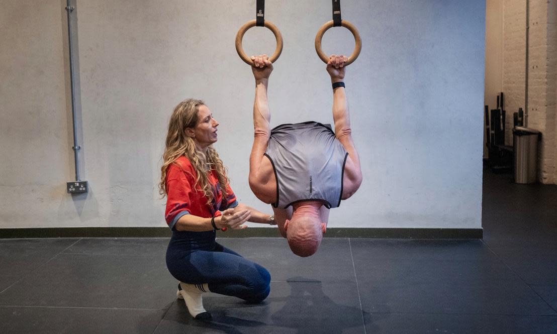 <span>‘Mobility should matter to you because it helps you to have fun’ … Daoust works on his ‘back lever’ with Lucy Joslin at the Mission studios in east London.</span><span>Photograph: Sarah Lee/The Guardian</span>