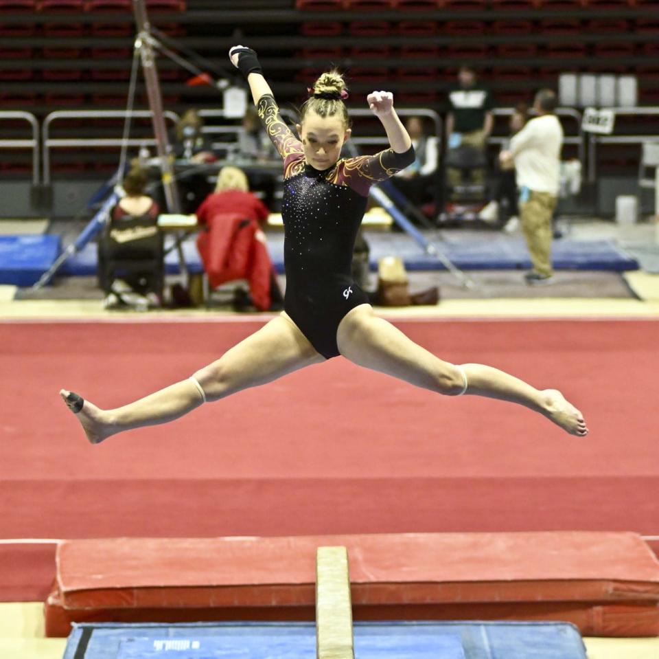 Bloomington North's Jessica Floyd does a skill on beam during the IHSAA state gymnastics meet at Ball State on Saturday, March 11, 2023.