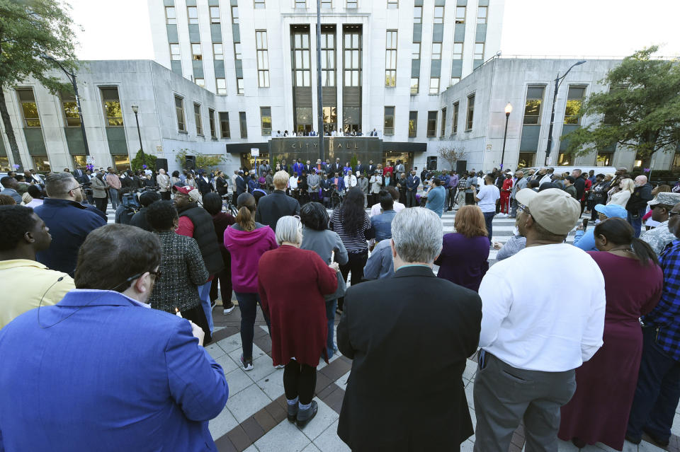 A candlelight vigil is held for Kamille "Cupcake" McKinney in Linn Park in front of Birmingham City Hall in Birmingham, Ala. Wednesday, Oct. 23, 2019. Police say they will charge two people with kidnapping and capital murder in the death of the 3-year-old Alabama girl whose body was found amid trash 10 days after being kidnapped outside a birthday party. (Joe Songer/AL.com. via AP)