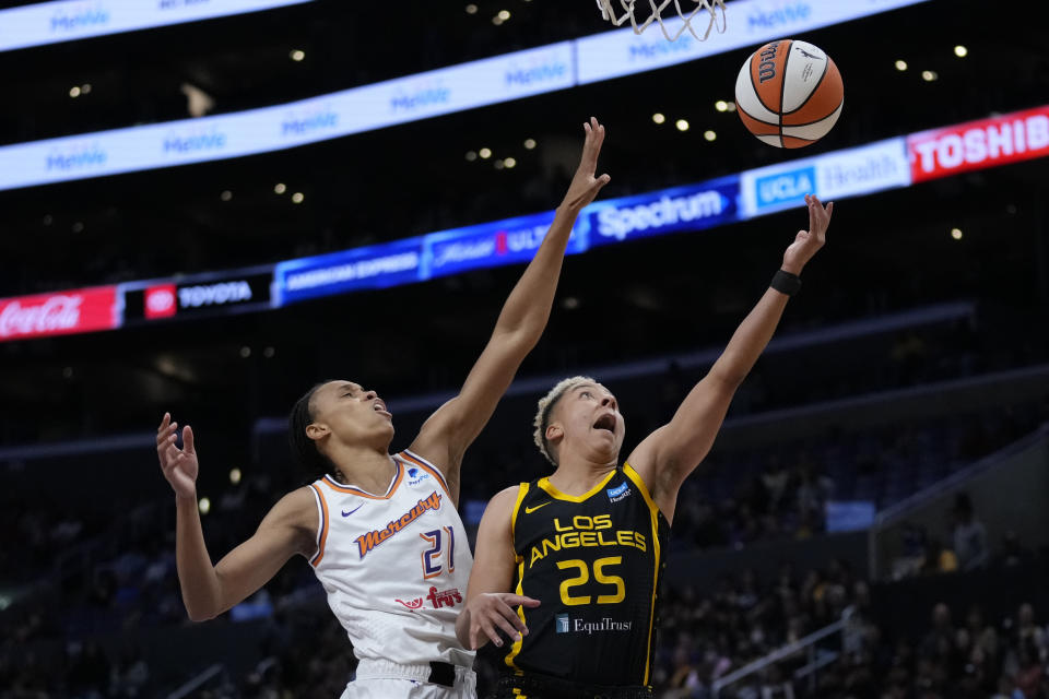 Los Angeles Sparks forward Layshia Clarendon (25) shoots against Phoenix Mercury forward Brianna Turner (21) during the first half of a WNBA basketball game in Los Angeles, Friday, May 19, 2023. (AP Photo/Ashley Landis)