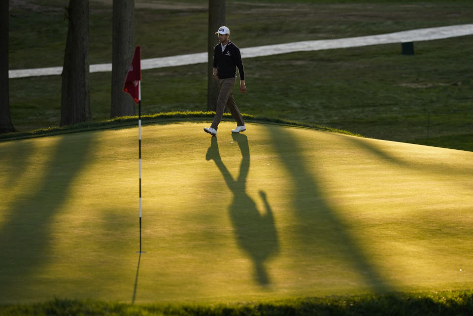 Harris English, of the United States, walks onto the 18th green during the third round of the US Open Golf Championship, Saturday, Sept. 19, 2020, in Mamaroneck, N.Y. (AP Photo/Charles Krupa)