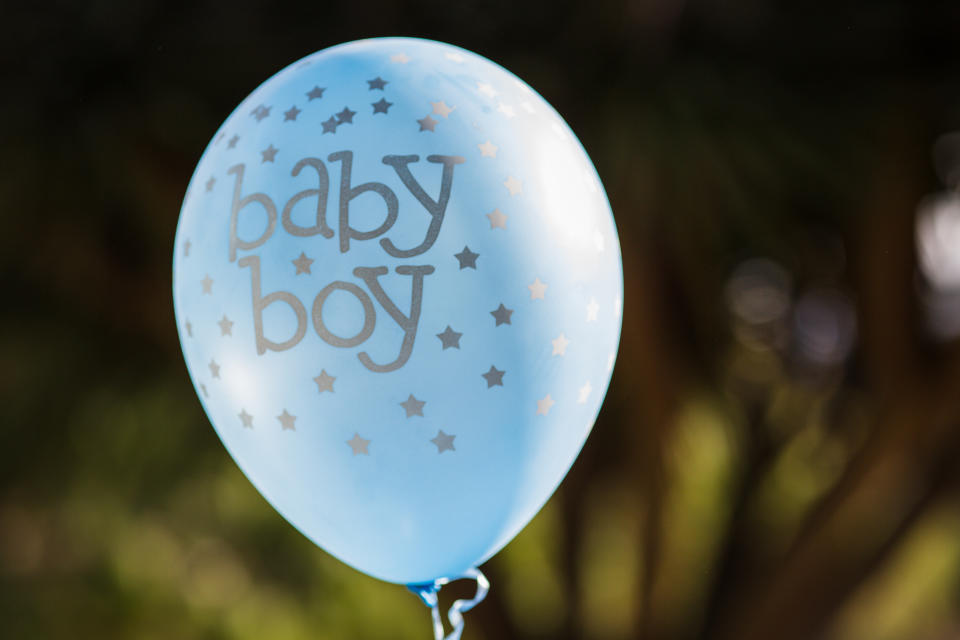 A photo of a blue baby boy balloon.