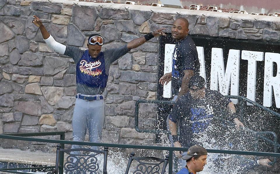 Los Angeles players celebrate in the Chase Field pool on Thursday after they clinched the 2013 NL West title.
Ross D. Franklin/AP
Los Angeles Dodgers players celebrate in the Chase Field pool after the Dodgers clinched the NL West title with a 7-6 win over the Arizona Diamondbacks in a baseball game Thursday, Sept. 19, 2013, in Phoenix. (AP Photo/Ross D. Franklin)