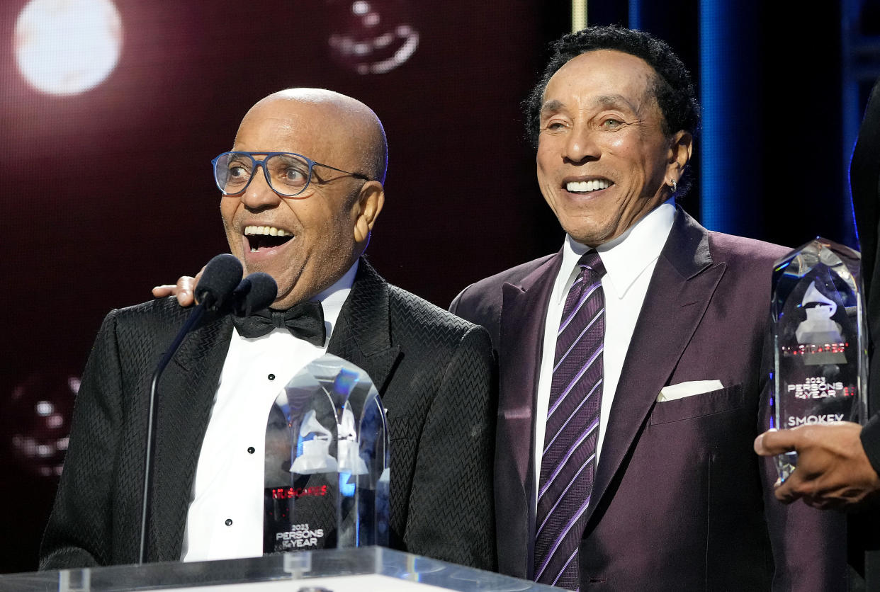 Berry Gordy and Smokey Robinson speak onstage during MusiCares Persons of the Year gala. (Photo: Kevin Mazur/Getty Images for The Recording Academy)