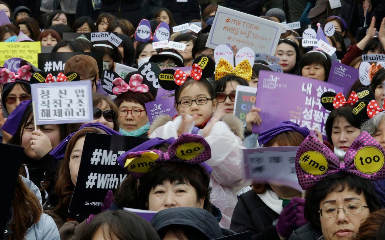 A South Korean girl is among people supporting the MeToo movement during a rally to mark International Women's Day in Seoul - AP