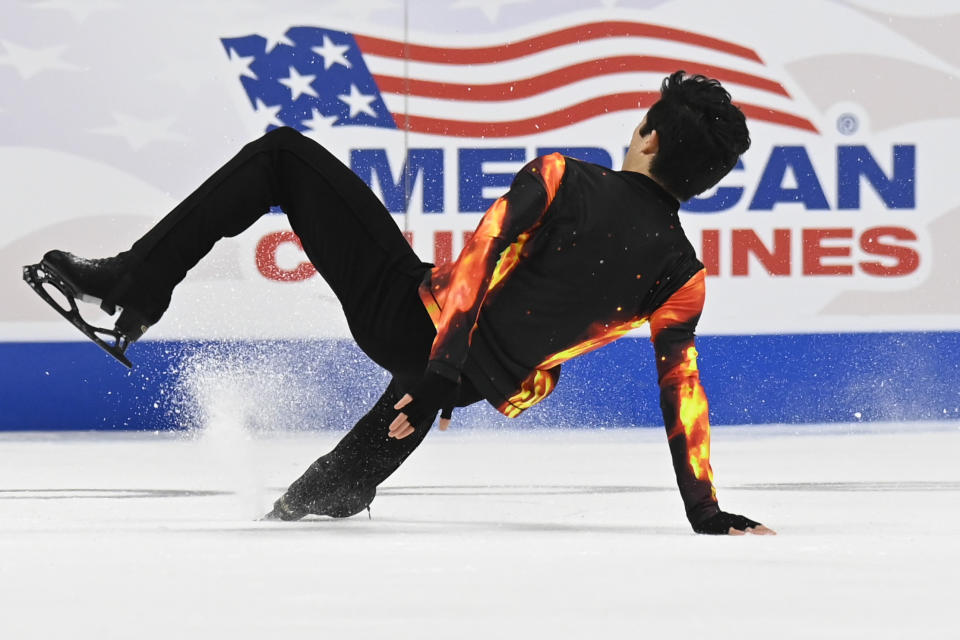 Nathan Chen falls in the men's free skate program during the U.S. Figure Skating Championships Sunday, Jan. 9, 2022, in Nashville, Tenn. (AP Photo/Mark Zaleski)