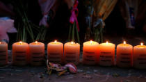 Candles burn with the names of the dead during the first anniversary of the Manchester Arena bombing, in Manchester, Britain, May 22, 2018. REUTERS/Andrew Yates