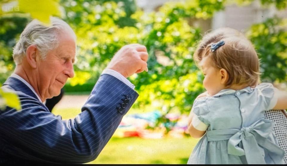 King Charles entertaining Princess Charlotte