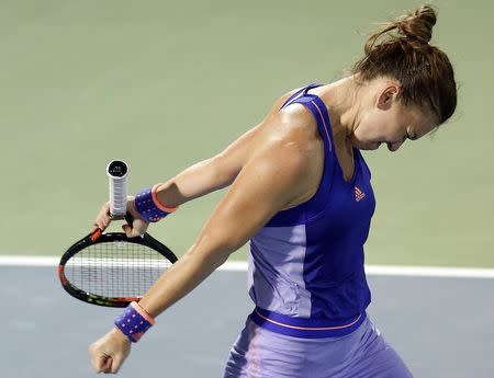 Simona Halep of Romania celebrates after beating Caroline Wozniacki of Denmark in their women's singles tennis semi-final match at the WTA Dubai Tennis Championships February 20, 2015. REUTERS/Ahmed Jadallah