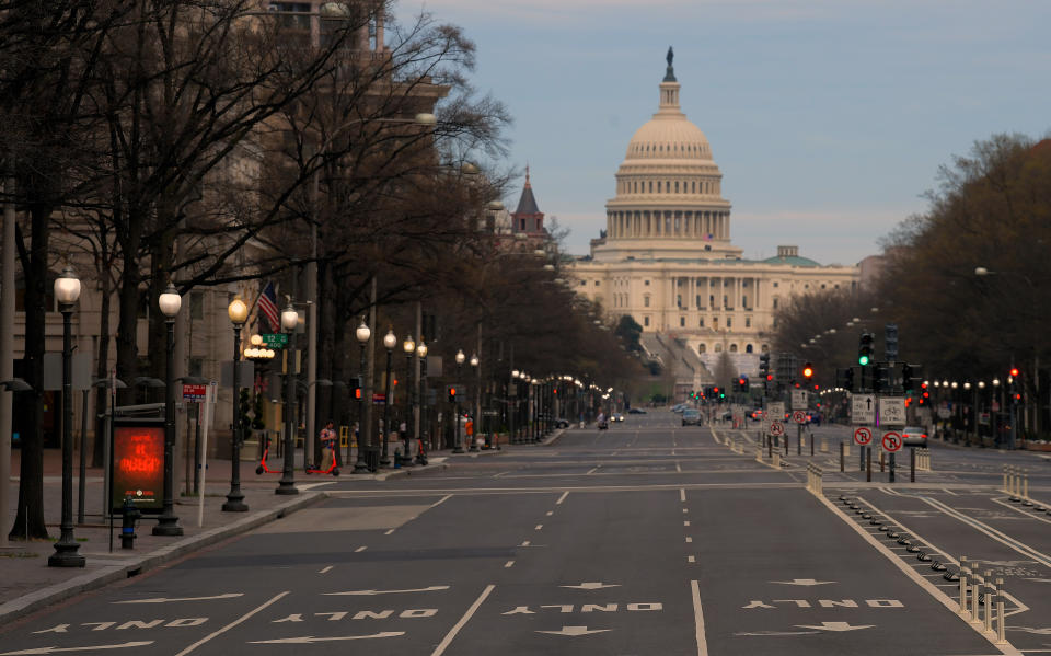 WASHINGTON, DC- MARCH 20: Looking east towards the Capitol Building on a vacant Pennsylvania Avenue at 6:49 pm  due to the coronavirus pandemic in Washington, DC on March 20, 2020 . (Photo by John McDonnell/The Washington Post via Getty Images)