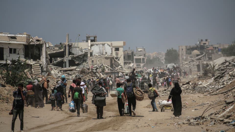 Palestinians leave eastern Khan Younis, after the Israeli military ordered people to evacuate parts of the city in southern Gaza, on July 22. - Ahmad Salem/Bloomberg/Getty Images