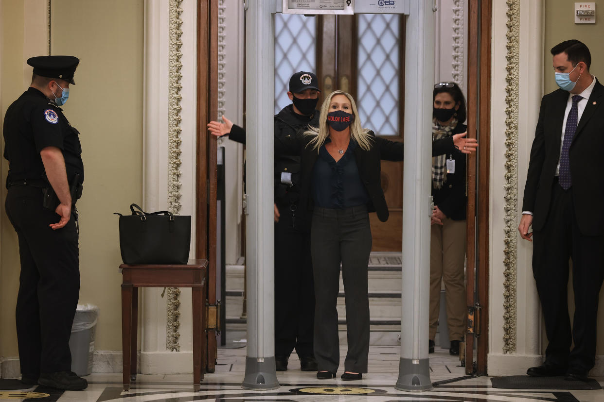 Rep. Marjorie Taylor Greene (R-GA) is searched by U.S. Capitol Police after setting off the metal detector outside the doors. (Photo by Chip Somodevilla/Getty Images)