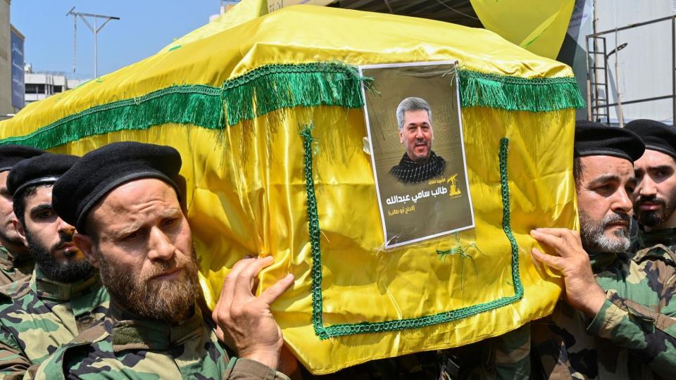 Members of Hezbollah carry the coffin of commander Taleb Sami Abdullah during his funeral in Beirut, Lebanon (June 12, 2024)