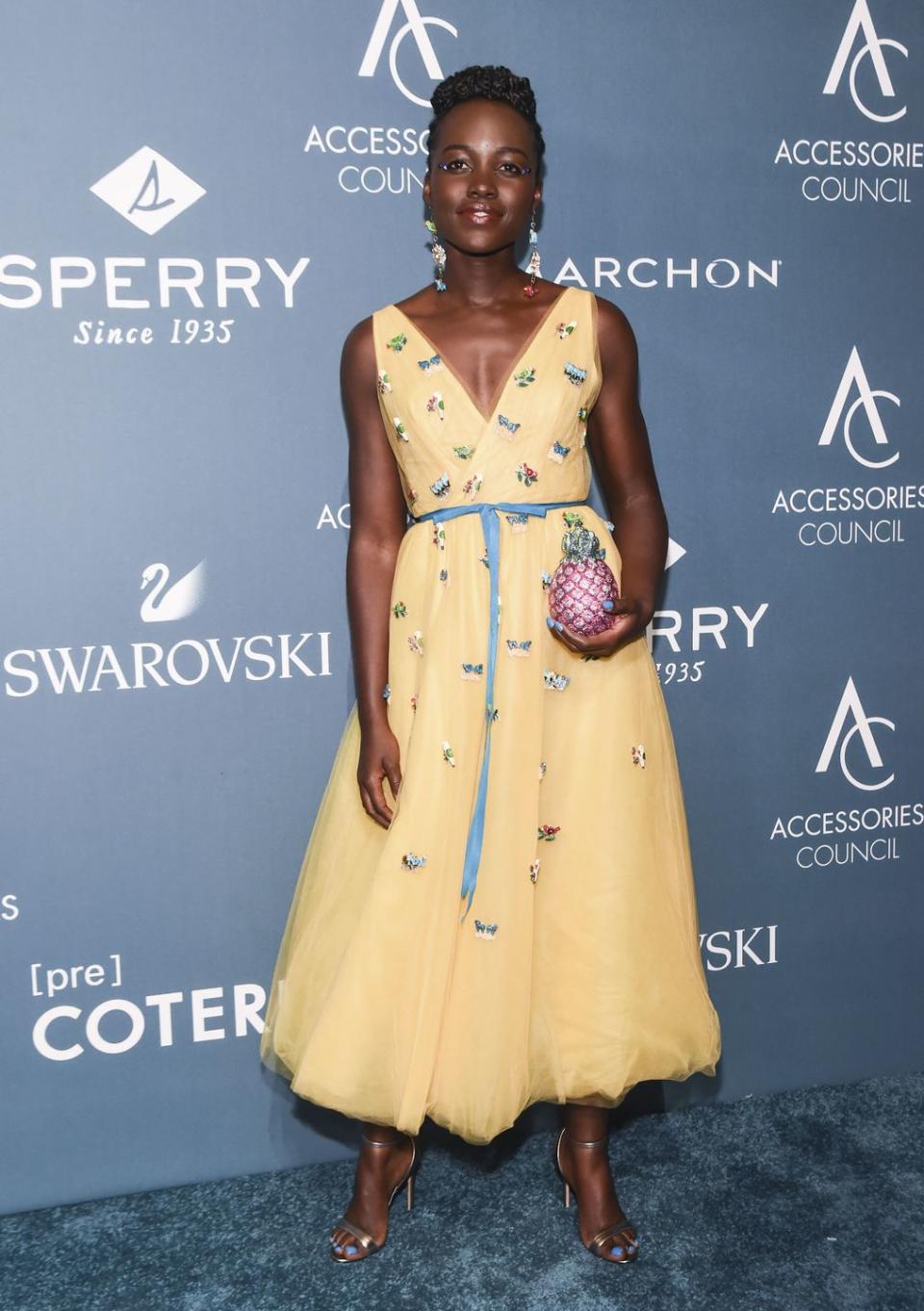 <p>The actress wore a Carolina Herrera dress with a Judith Leiber pineapple clutch to the Accessories Council ACE Awards in New York.</p>