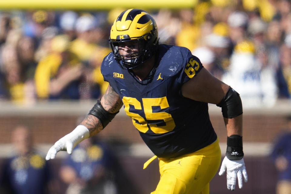 FILE - Michigan offensive lineman Zak Zinter plays against UNLV in the first half of an NCAA college football game in Ann Arbor, Mich., Saturday, Sept. 9, 2023. Zinter has been selected to The Associated Press midseason All-America team, Wednesday, Oct. 18, 2023.(AP Photo/Paul Sancya, File)