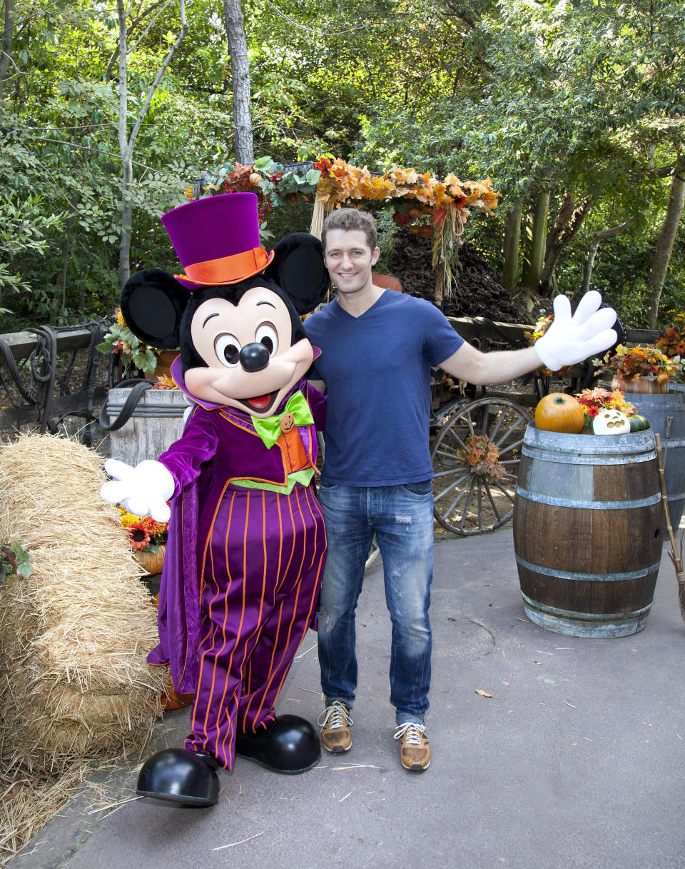 'Glee' star Matthew Morrison poses with a Halloween-themed Mickey Mouse on October 13, 2012 at Disneyland Park in Anaheim, California.  In addition to celebrating Halloween at the park, Morrison also marked the visit with an early celebration of his October 30th birthday.  (Photo by Paul Hiffmeyer/Disney Parks via Getty Images)