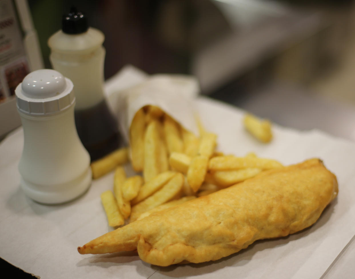 A portion of cod and chips in a chip shop in Dublin.