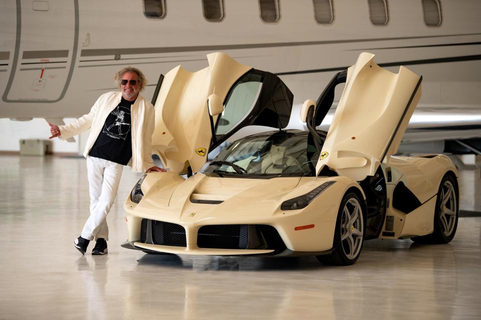 Sammy Hagar stands next to his 2015 Ferrari LaFerrari, a rare supercar (only 499 were made) that he hopes to sell for perhaps triple its original $1.5 million price at the Barrett-Jackson auctions this January. The car's interior was made to match his jet's.