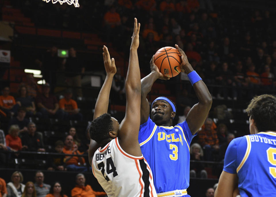 UCLA forward Adem Bona (3) looks to shoot over Oregon State center KC Ibekwe (24) during the first half of an NCAA college basketball game Thursday, Dec. 28, 2023, in Corvallis, Ore. (AP Photo/Mark Ylen)