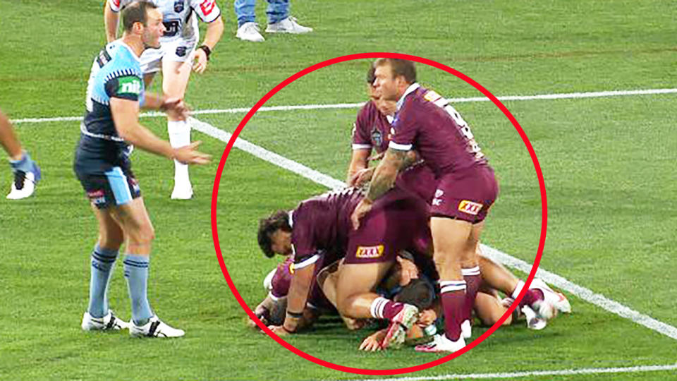 Five Queensland players, pictured here on the James Tedesco tackle.