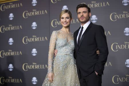 Cast members Lily James and Richard Madden pose at the premiere of "Cinderella" at El Capitan theatre in Hollywood, California March 1, 2015. REUTERS/Mario Anzuoni