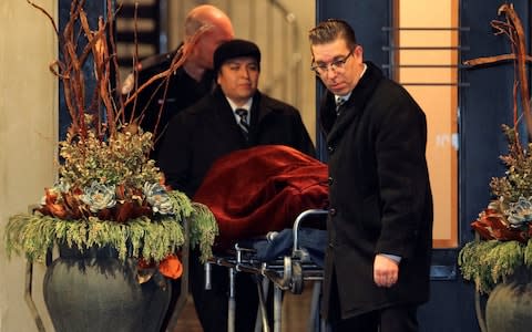 One of two bodies is removed from the home of Barry Sherman - Credit: CHRIS HELGREN