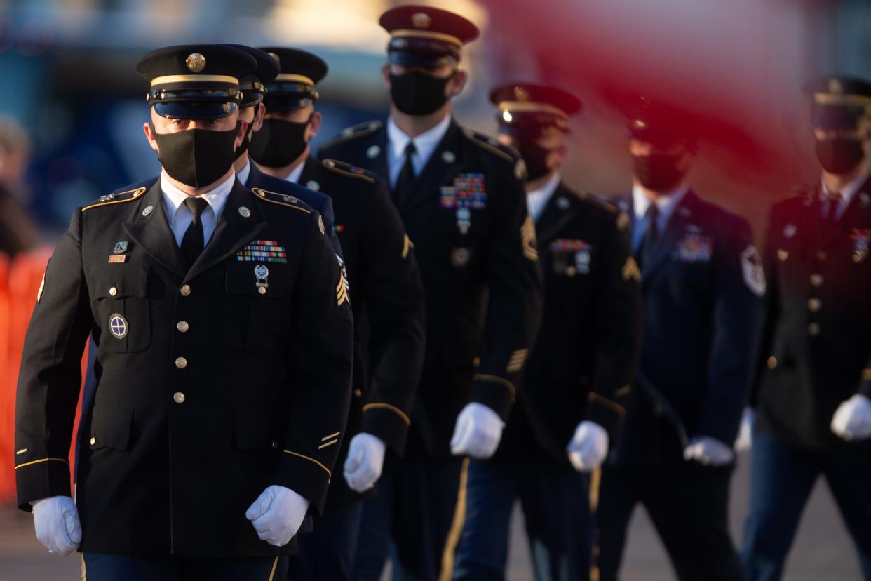 Kansas lawmakers are expressing concerns about a Defend the Guard Act bill that would ban COVID-19 vaccine mandates and block deployments of the Kansas National Guard. Here, members of the Kansas National Guard Casket Team, Color Guard and other armed services accompany the late Sen. Bob Dole to the Kansas Statehouse in December.