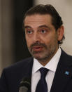 Lebanese Prime Minister-Designate Saad Hariri speaks to journalists at the Presidential Palace in Baabda, east of Beirut, Lebanon, Thursday, Oct, 22, 2020. Lebanon's president Michel Aoun asked former premier Saad Hariri to form the country's next government Thursday after he secured enough votes from lawmakers - bringing back an old name to lead the country out of its dire political and economic crises. (AP Photo/Hussein Malla)