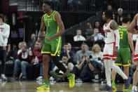 Oregon center N'Faly Dante (1) celebrates after a play against Arizona during the second half of an NCAA college basketball game in the semifinal round of the Pac-12 tournament Friday, March 15, 2024, in Las Vegas. (AP Photo/John Locher)