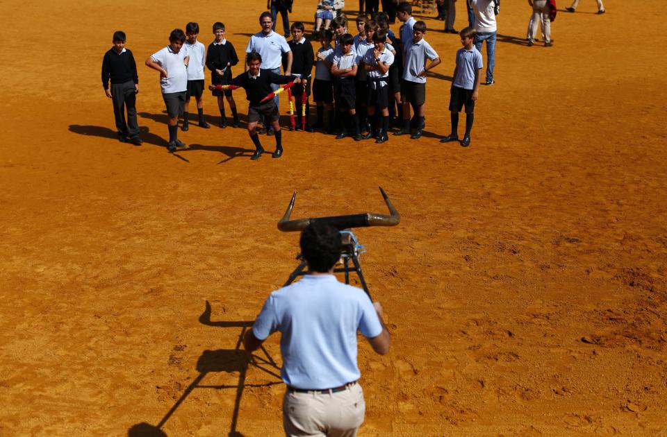 Students attend a bullfight master class for schoolchildren at the Maestranza bullring in the Andalusian capital of Seville