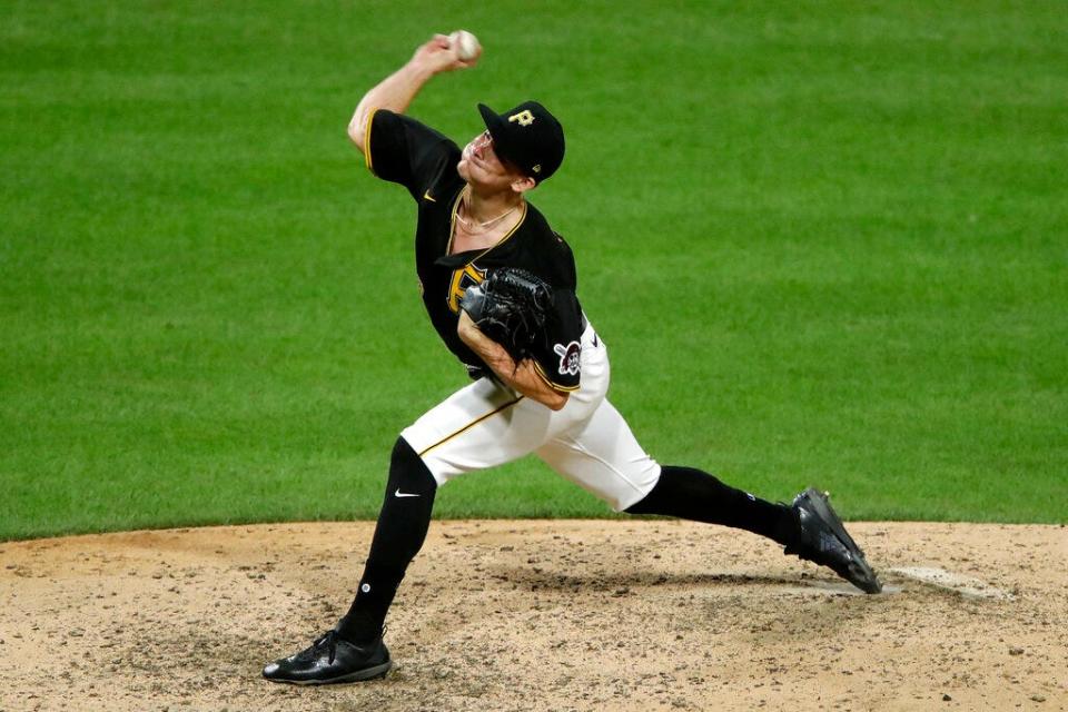 Pittsburgh Pirates relief pitcher Nick Burdi delivers during the ninth inning of a baseball game against the Milwaukee Brewers in Pittsburgh, Tuesday, July 28, 2020. Burdi collected his first major league save in the 8-6 Pirates win. (AP Photo/Gene J. Puskar)