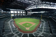 Texas Rangers begin to take to the field for a baseball practice at Globe Life Field in Arlington, Texas, Friday, July 3, 2020. The practice was the first team activity in the organization's newly constructed stadium. (AP Photo/Tony Gutierrez)