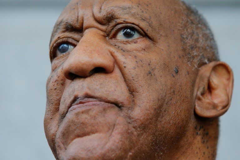 Bill Cosby exits a Pennsylvania courthouse after a mistrial was declared in his sexual assault trial