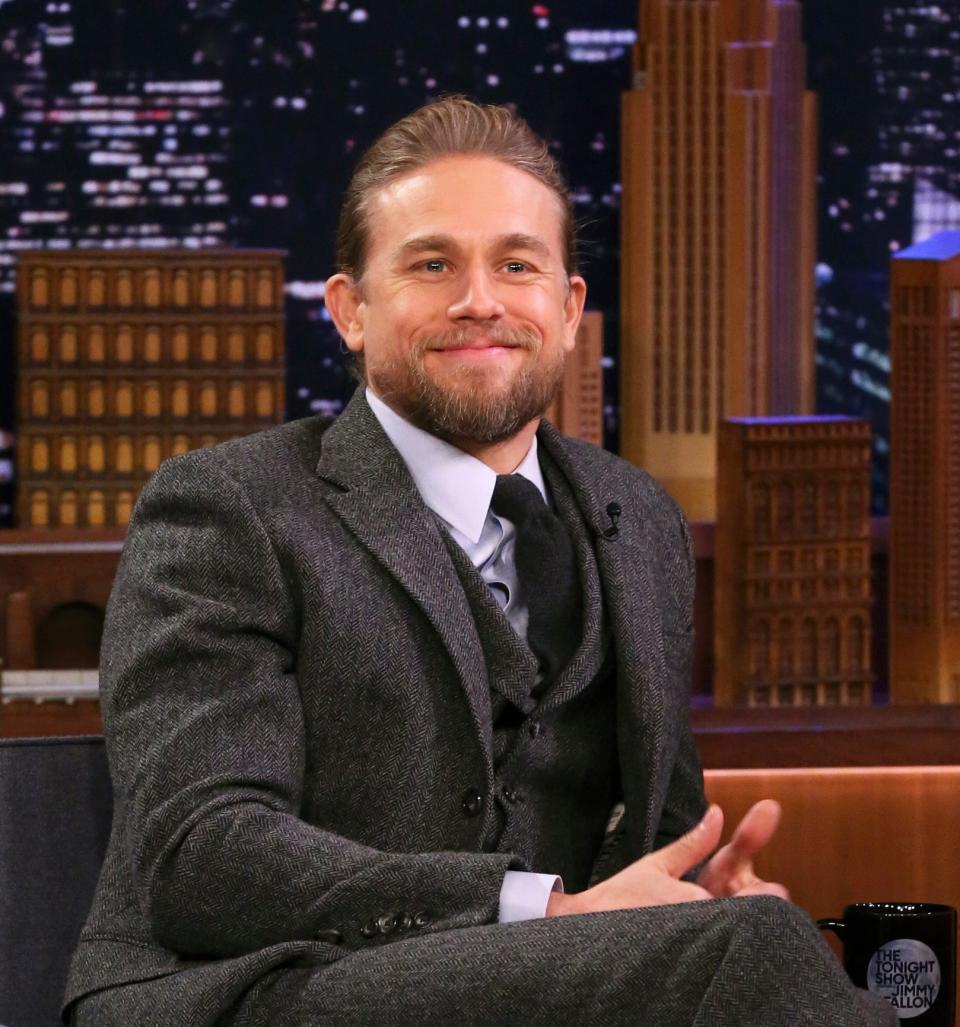 Charlie Hunnam sitting for a late night TV interview