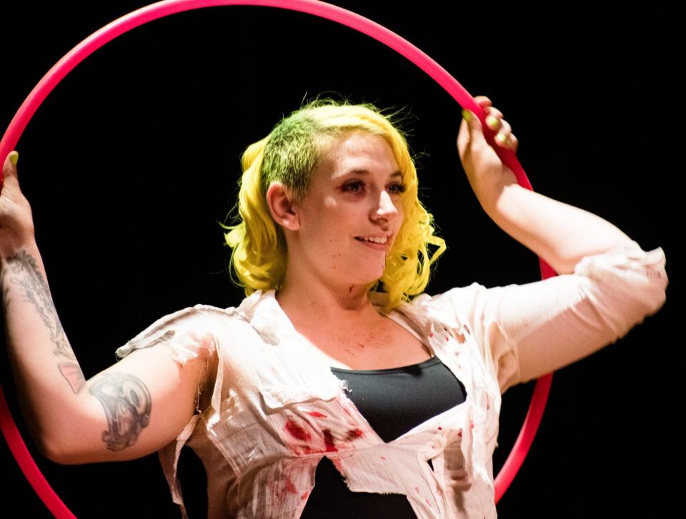 Sam Rezz performs an artistic hula hoop routine during a Vagrant Fear variety show June 11 at Ames City Auditorium.