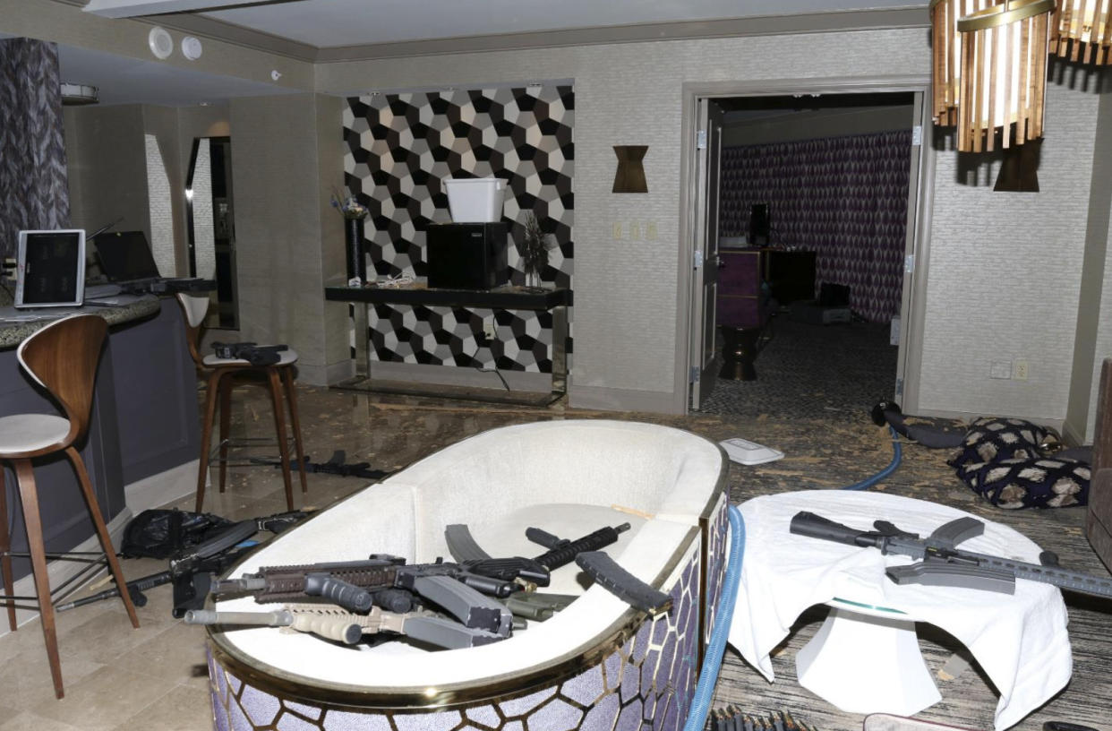 FILE - This Oct. 2017 file photo released by the Las Vegas Metropolitan Police Department Force Investigation Team Report shows a number of guns in the interior of mass shooter Stephen Paddock's 32nd floor room of the Mandalay Bay hotel in Las Vegas. Paddock a high-roller gambler who opened fire in 2017 on concertgoers in Las Vegas had lost tens of thousands of dollars while gambling weeks before the mass shooting and was upset with the way the casinos had been treating him, according to FBI documents made public this week. (Las Vegas Metropolitan Police Department via AP, File)