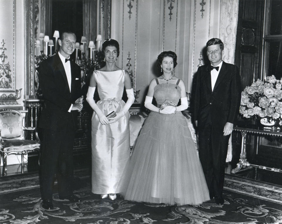 At Buckingham Palace during a banquet held in his honor, American President John F. Kennedy and his wife, First Lady Jacqueline Kennedy, pose with Queen Elizabeth II of Great Britain and her husband, Prince Philip, Duke of Edinburgh, London, United Kingdom, June 15, 1961.