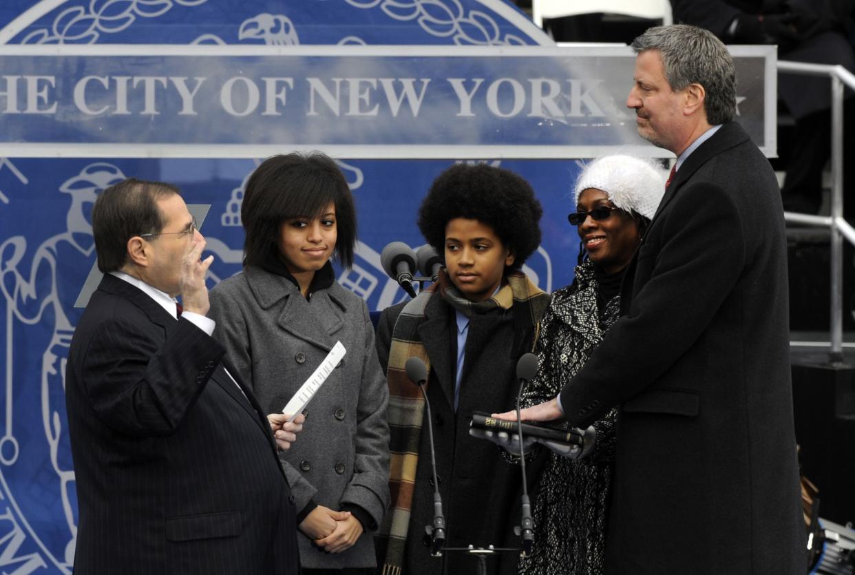 Bill de Blasio (r.) is sworn in as New York City public advocate by Congressman Jerrold Nadler during a ceremony on the steps of City Hall on Jan. 1, 2010 in New York. Wife and First Lady of New York City Charlane (2-r), son Dante (c.) and daughter Chiara look on.