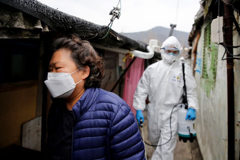 A woman wears a protective mask to prevent contracting the coronavirus at Guryong village in Seoul