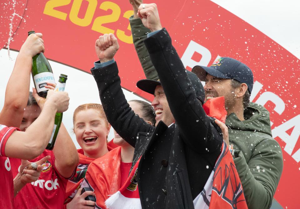Wrexham, Wrexham County Borough, Wales. 26th March 2023. Wrexham Co owners Rob McElhenney and Ryan Reynolds celebrate the Women's title, during Wrexham Association Football Club Women V Connah’s Quay Nomads Women at The Racecourse Ground, in in the Genero Adran North. (Credit Image: ©Cody Froggatt/Alamy Live News)