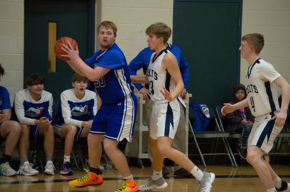 (50) Senior Wildcat Pat VanDusen looks for an open teammate in the final minutes of regulation.