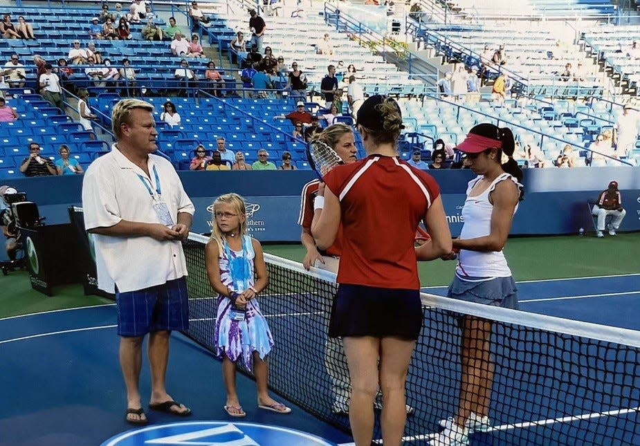 As a young girl, Peyton Stearns, pictured here second from the left performing the coin toss prior to a Western & Southern Open match, dreamed of one day playing in her hometown tournament. Stearns won her qualifying match Saturday Aug. 13, 2022 to advance to Sunday's main WTA draw.