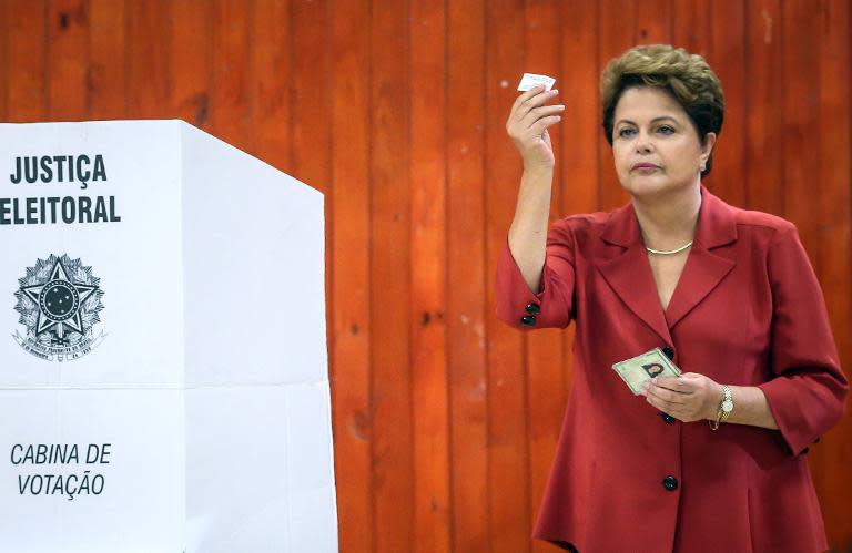 Brazilian President and presidential candidate for the Workers Party, Dilma Rousseff votes at a polling station in Porto Alegre, state of Rio Grande do Sul, Brazil, on October 26, 2014