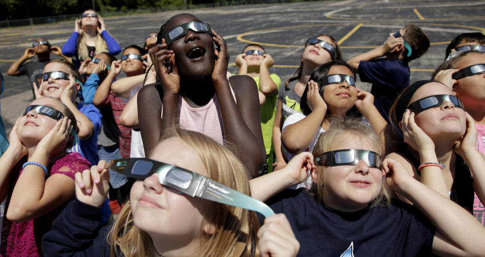 <p>In this photo taken Friday, Aug. 18, 2017, fourth graders at Clardy Elementary School in Kansas City, Mo., practice the proper use of their eclipse glasses in anticipation of Monday’s solar eclipse. (Photo: Charlie Riedel/AP) </p>